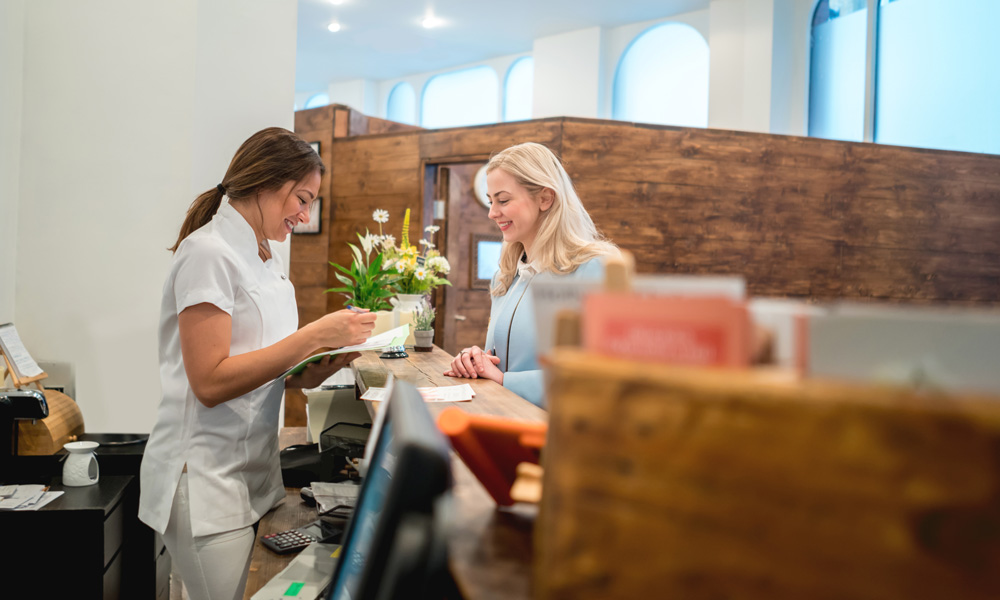 695177038 Small business owner sells almonds to a customer