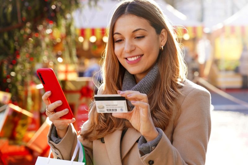 Woman making purchase on phone