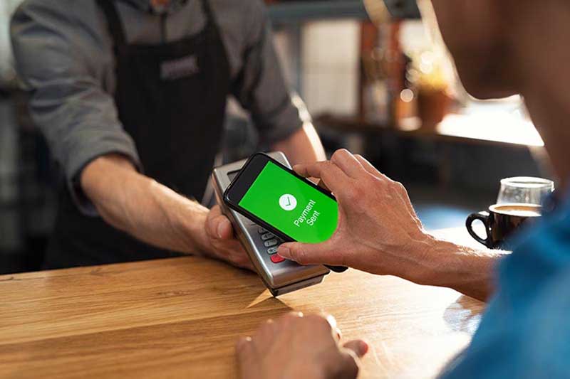 Mobile phone showing a sucessful payment completd via pay-at-the-table. 